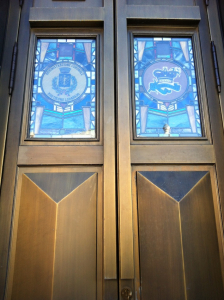The bronze & stained glass doors