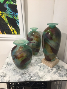 Trio, a group of painted & fired blown vessels